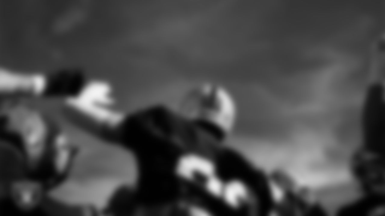 Las Vegas Raiders defensive end Maxx Crosby (98) in a huddle during practice at Intermountain Health Performance Center.