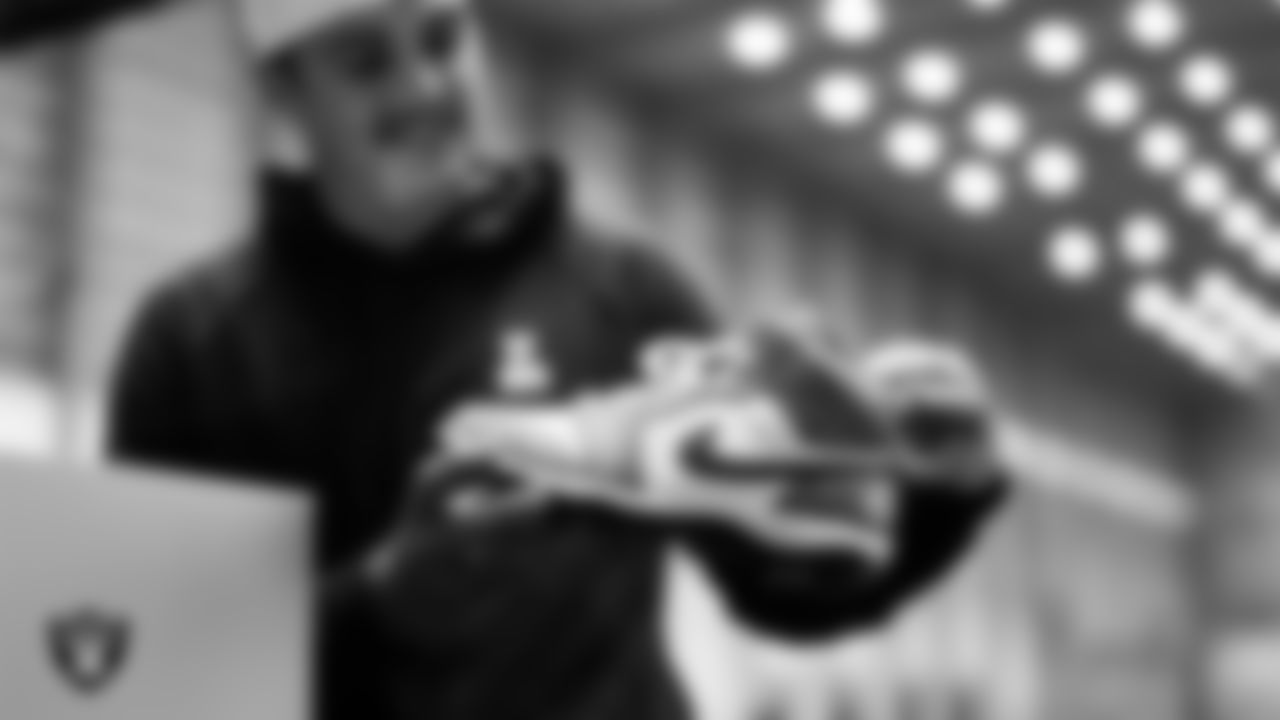 Las Vegas Raiders quarterback Aidan O'Connell (12) unboxes his custom cleats for the NFL's My Cause My Cleats initiative at Intermountain Health Performance Center.