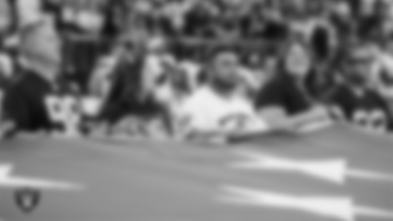 The American flag is displayed by Personal Seat License (PSL) holders on the field during the national anthem before the Las Vegas Raiders' regular season home game against the Cleveland Browns at Allegiant Stadium.