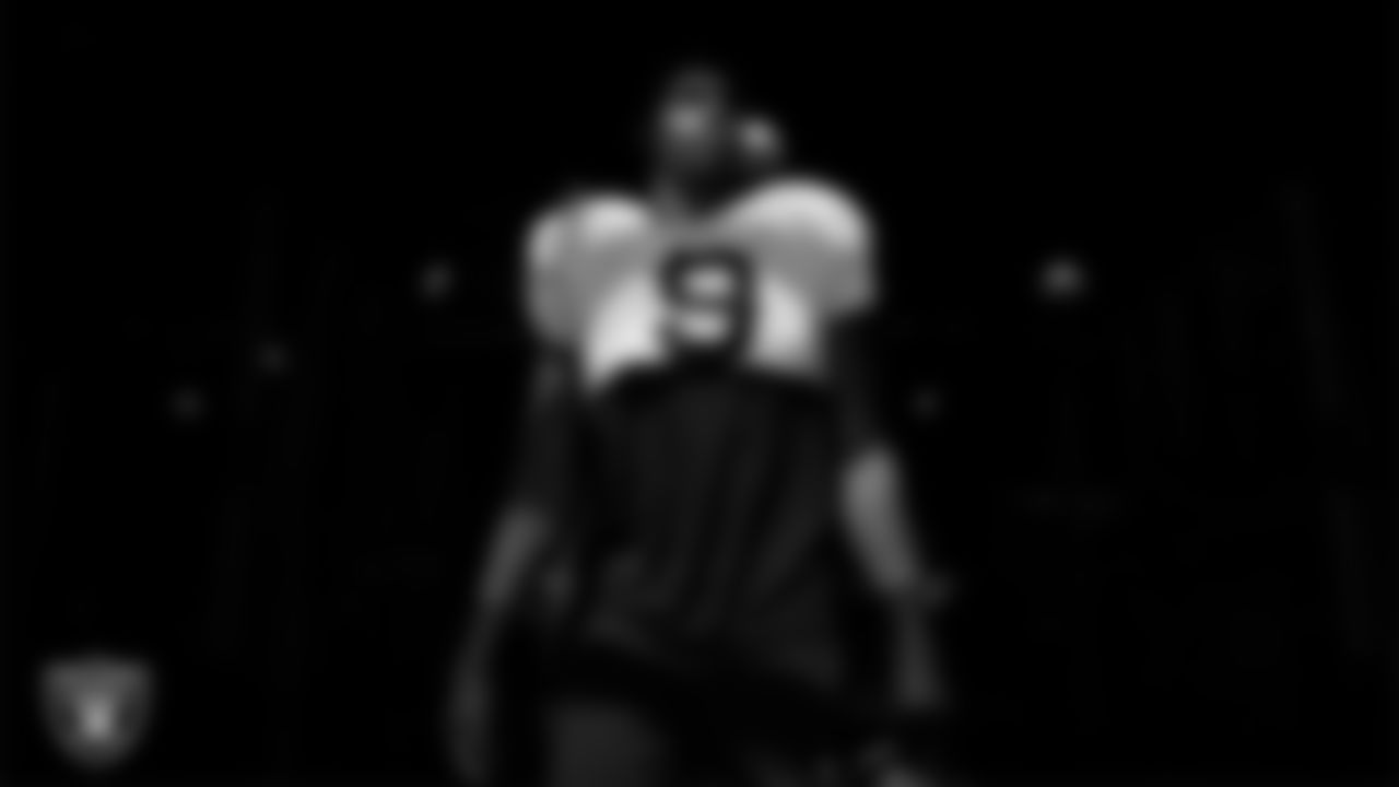 Las Vegas Raiders defensive end Tyree Wilson (9) walks out to the field for practice at Intermountain Health Performance Center.