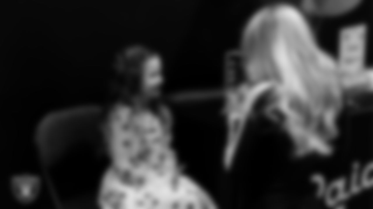 Raiderette Delaney does an attendee's makeup during the Valentine's Day Dance at The Studio.