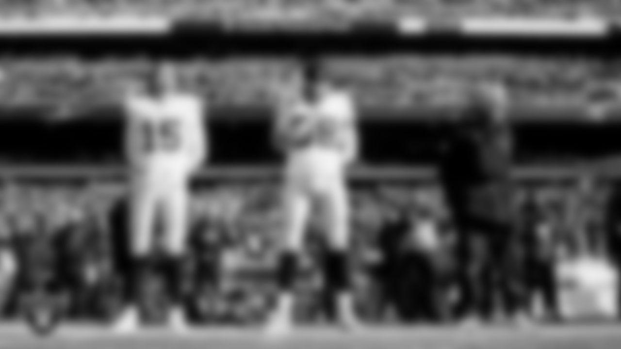 Las Vegas Raiders quarterback Kenny Pickett (15), defensive end Maxx Crosby (98) and Head Coach Pete Carroll during the national anthem before the regular season away game against the Philadelphia Eagles at Lincoln Financial Field.