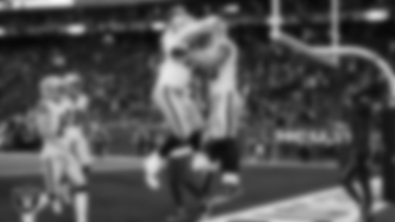 Las Vegas Raiders tight end Brock Bowers (89) celebrates with guard Caleb Rogers (76) after making a 7-yard touchdown catch during the regular season away game against the Houston Texans at NRG Stadium.