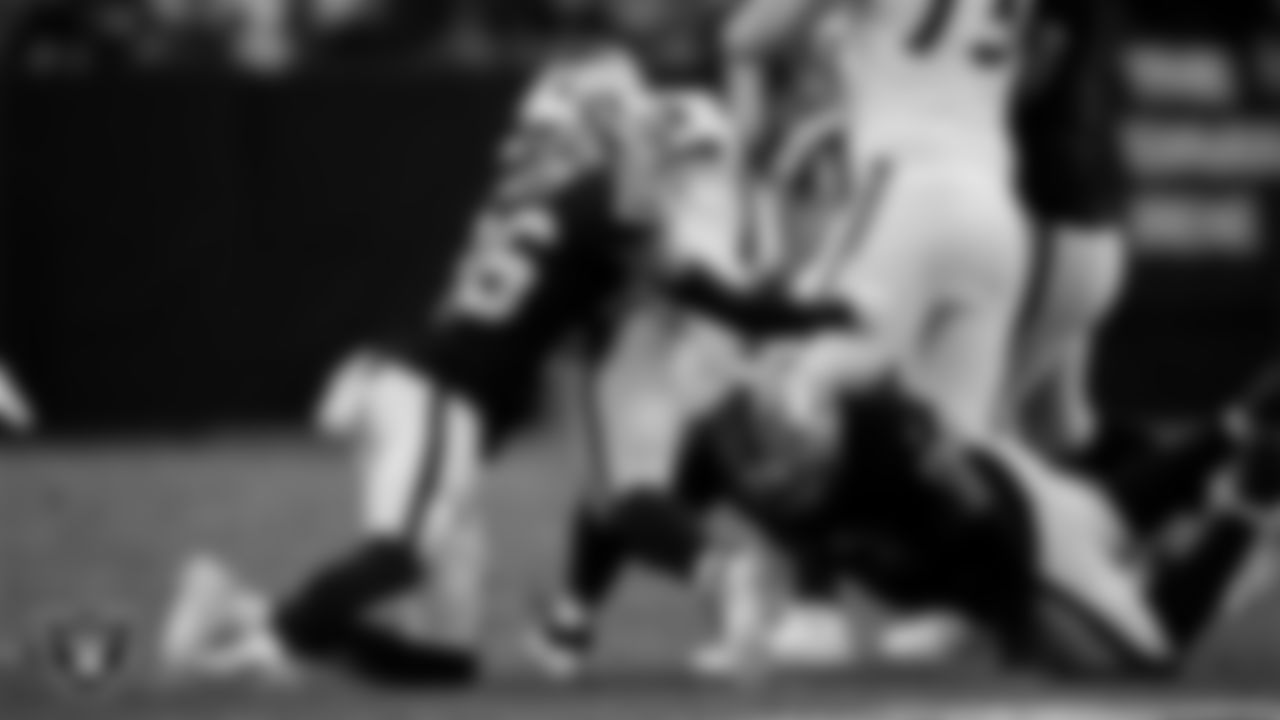 Las Vegas Raiders cornerback Darien Porter (26) and defensive tackle JJ Pegues (92) during the regular season home game against the Denver Broncos at Allegiant Stadium.