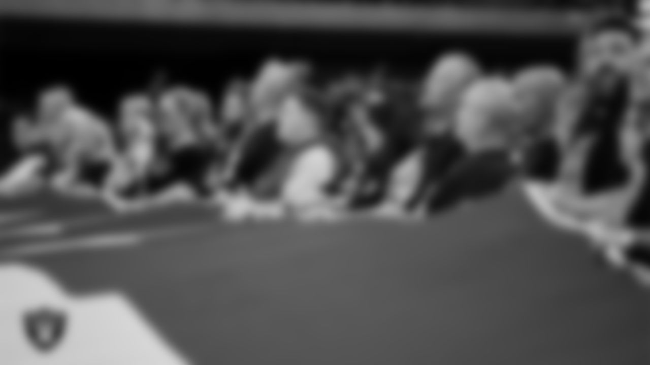 The American flag is displayed by Personal Seat License (PSL) holders on the field during the national anthem before the Las Vegas Raiders' regular season home game against the Jacksonville Jaguars at Allegiant Stadium.