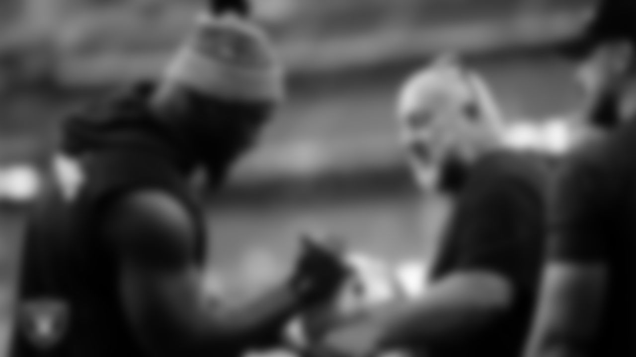 Las Vegas Raiders linebacker Devin White (45) signs autographs for fans before the regular season away game against the Houston Texans at NRG Stadium.