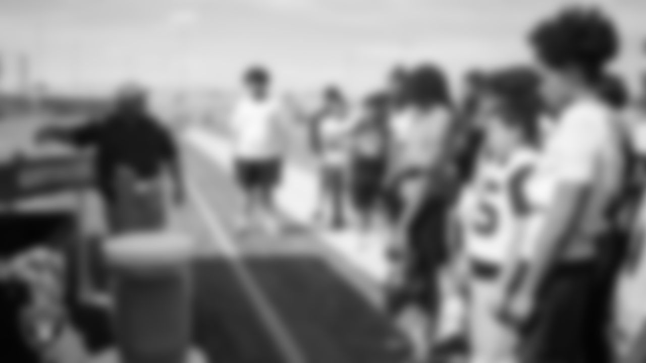 Las Vegas Raiders senior manager of football development Jordan Aguilar talks to the Clark High School football team before a spring football practice at Clark High School.