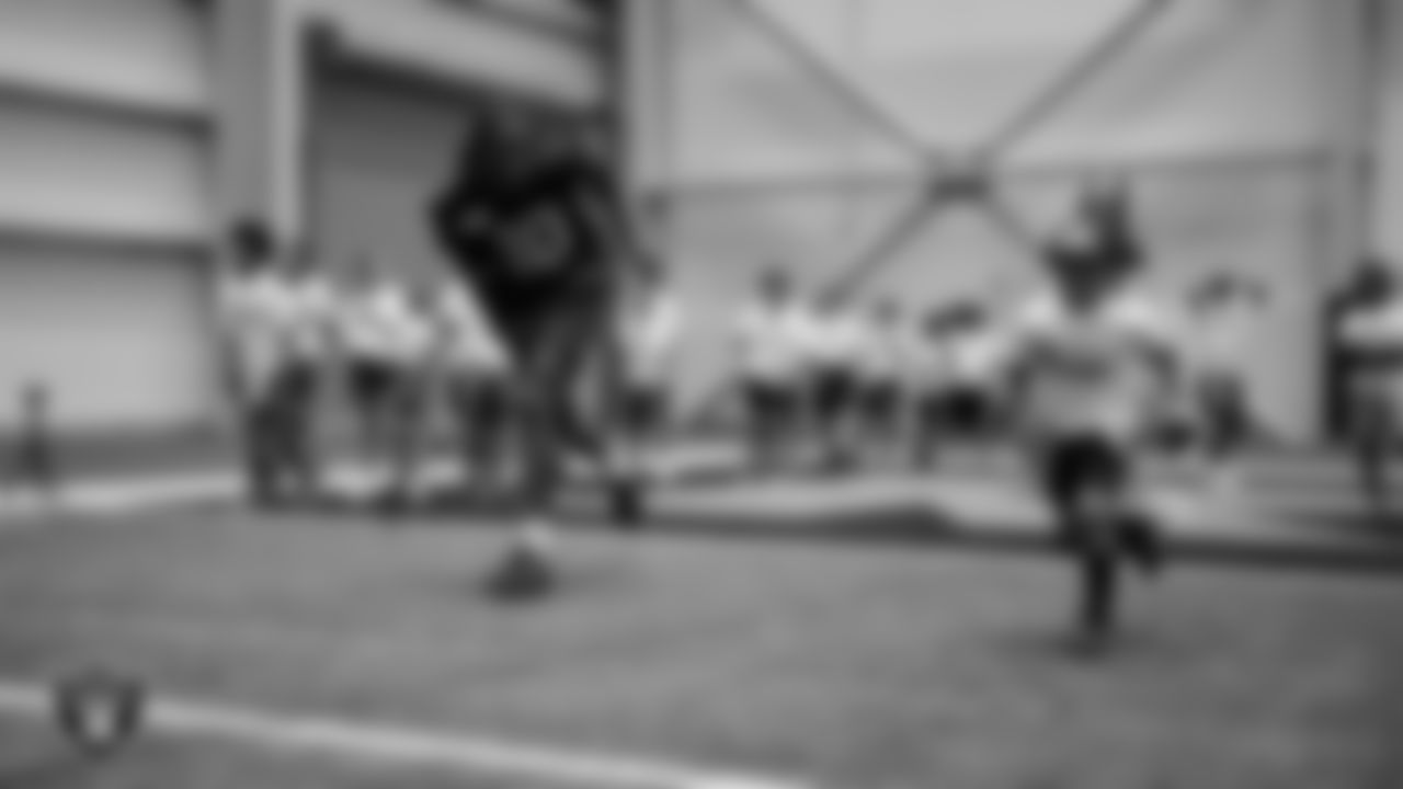 Las Vegas Raiders wide receiver Dont'e Thornton Jr. (10) works with athletes at a skills camp during Play Football Day at Intermountain Health Performance Center.