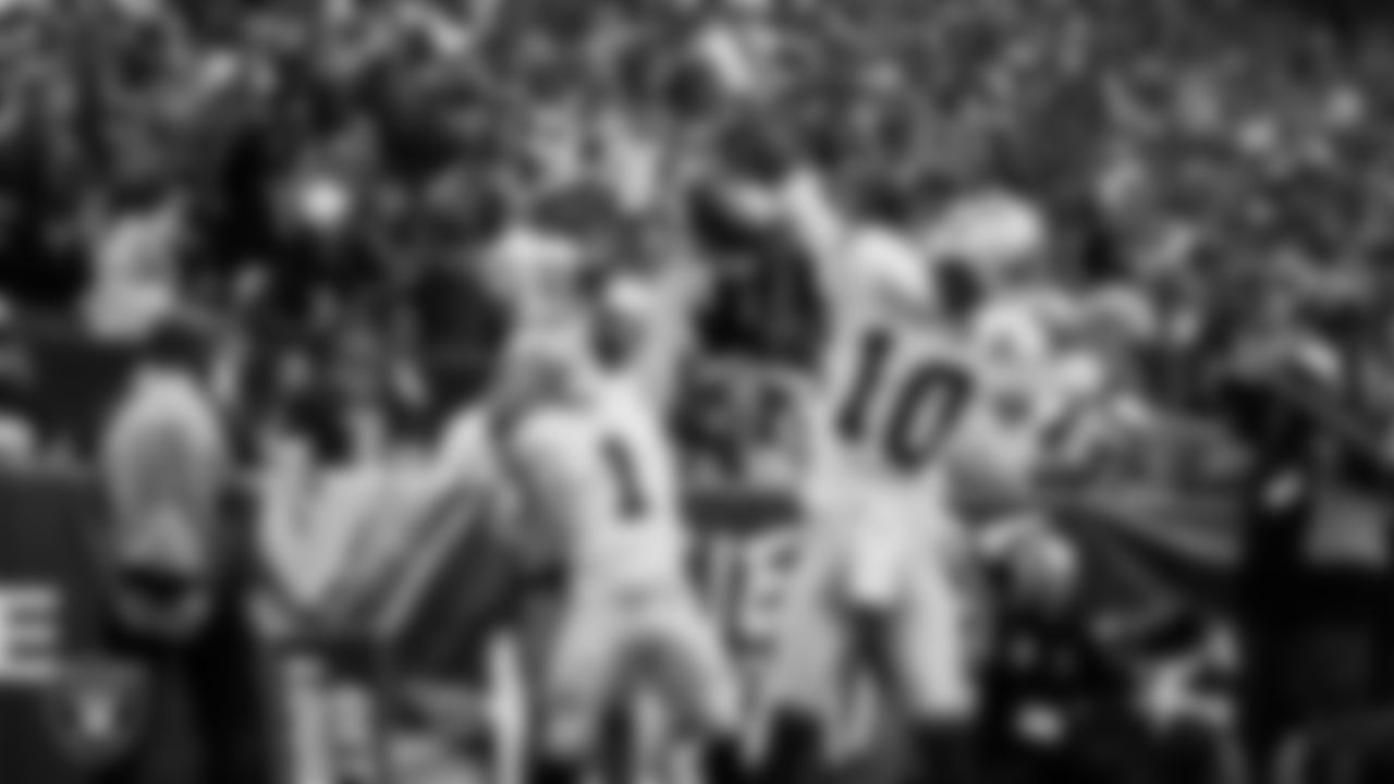 Las Vegas Raiders wide receiver Tre Tucker (1) celebrates with wide receiver Dont'e Thornton Jr. (10) after making a 10-yard touchdown catch during the regular season away game against the Washington Commanders at Northwest Stadium.