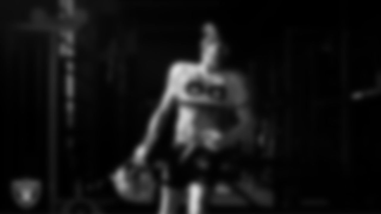 Las Vegas Raiders defensive end Maxx Crosby (98) walks out to the field for practice at Intermountain Health Performance Center.