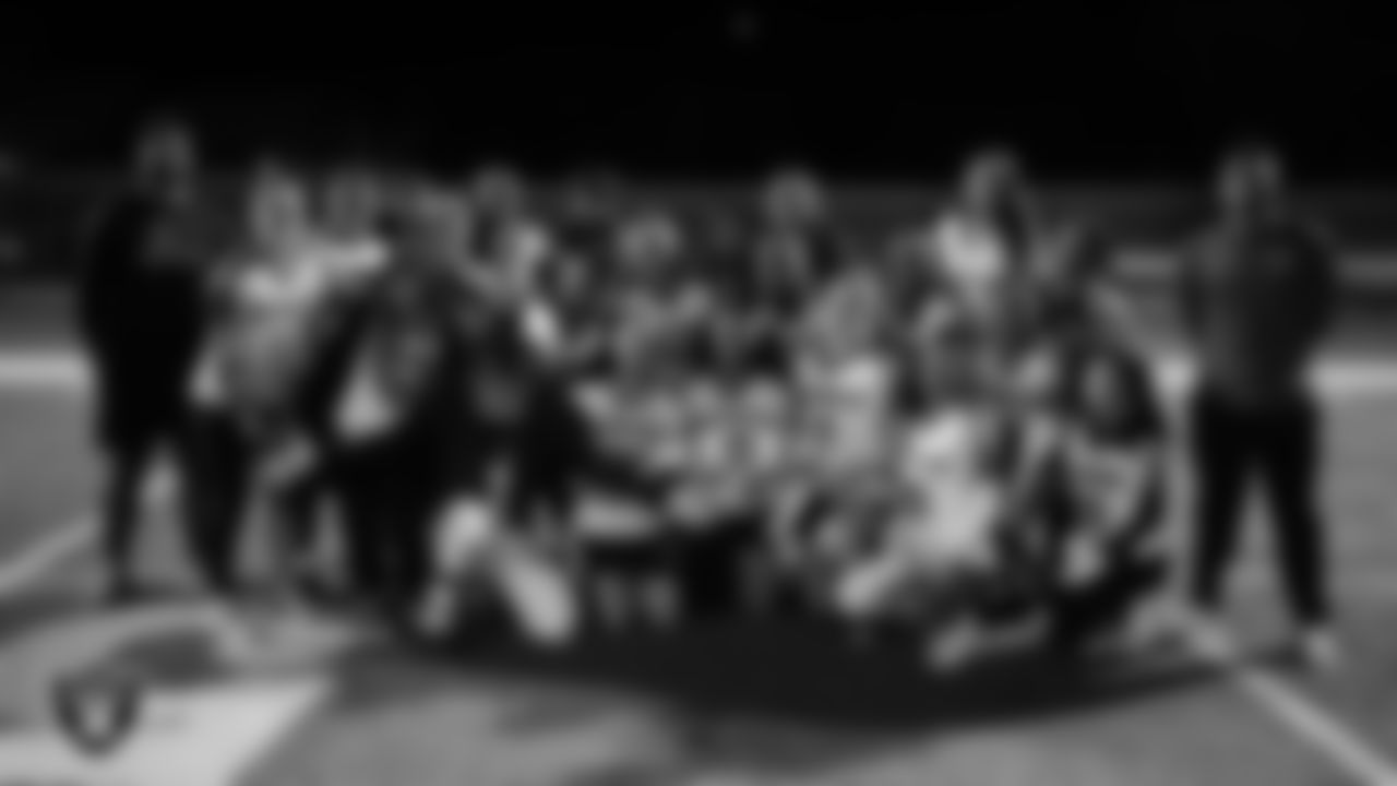 The Las Vegas High School flag football team poses for a photo after winning the Las Vegas Raiders' High School Flag Football Showcase game at Mater East Academy.
