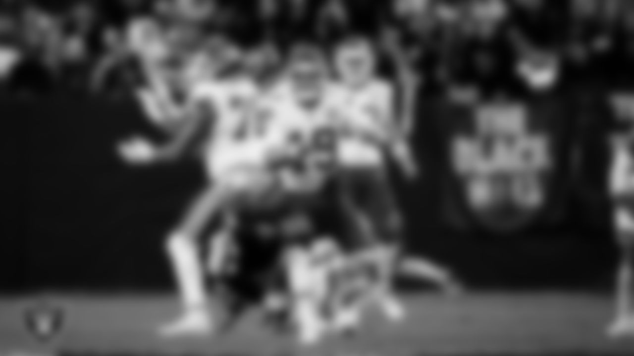 Las Vegas Raiders defensive end Tyree Wilson (9) forces a fumble during the regular season home game against the Kansas City Chiefs at Allegiant Stadium.