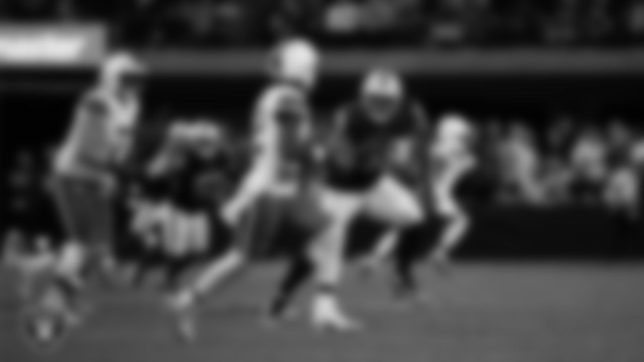 Las Vegas Raiders defensive tackle Thomas Booker IV (99) pressures the quarterback during the regular season home game against the Cleveland Browns at Allegiant Stadium.