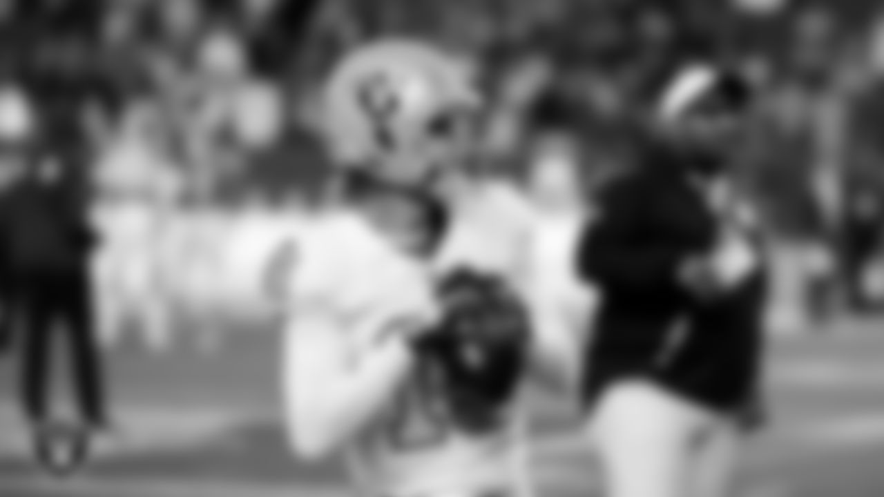 Las Vegas Raiders quarterback Kenny Pickett (15) warming up before the regular season away game against the Denver Broncos at Empower Field at Mile High.