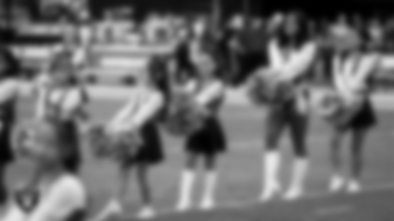 Raiderette Sloane and Junior Raiderettes perform on the field before the preseason home game against the San Francisco 49ers at Allegiant Stadium.