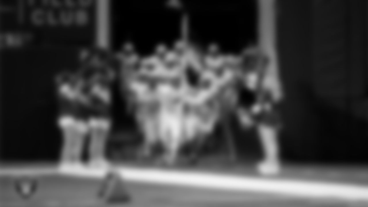 The Pahranagat Valley High School football team takes the field before the NIAA 1A Division State Championship game against Tonopah High School at Allegiant Stadium.