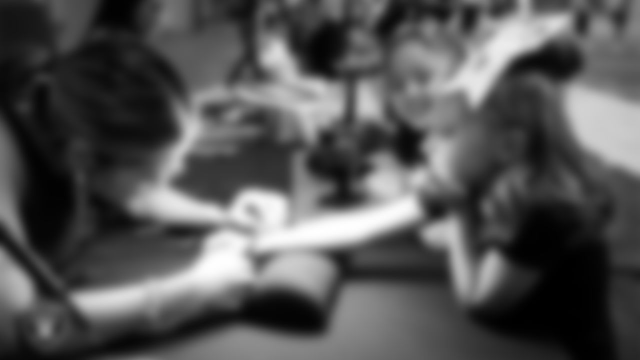 Dancers receive permanent jewelry during day three of summer camp at Intermountain Health Performance Center.