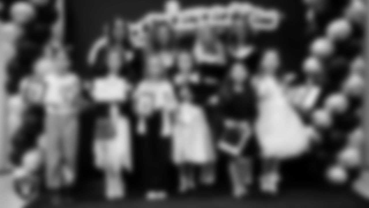 Raiderettes pose for a photo with Junior Raiderettes during the Junior Raiderettes Banquet at The Studio.