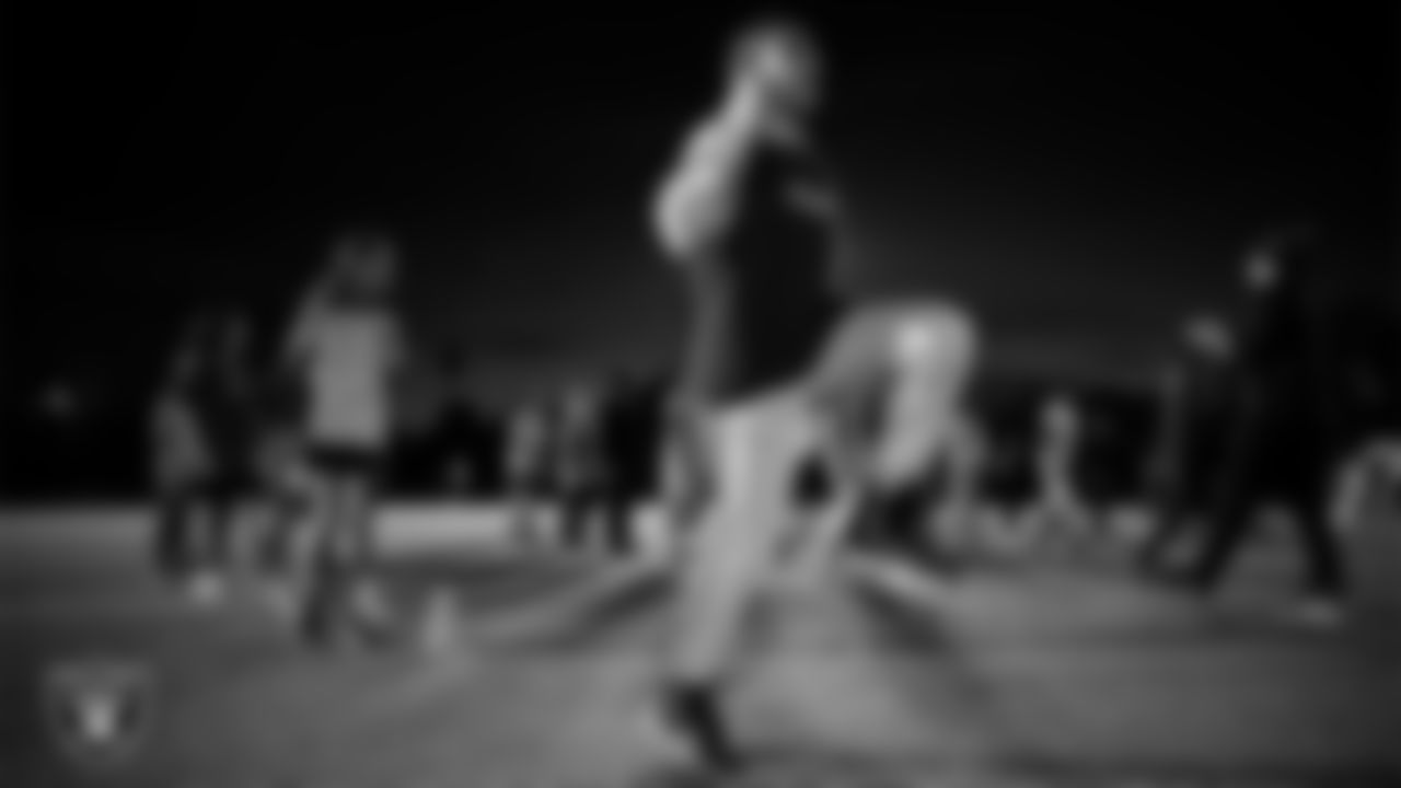 An athlete takes part in a Silver and Black League flag football clinic at Bill and Lillie Heinrich YMCA.