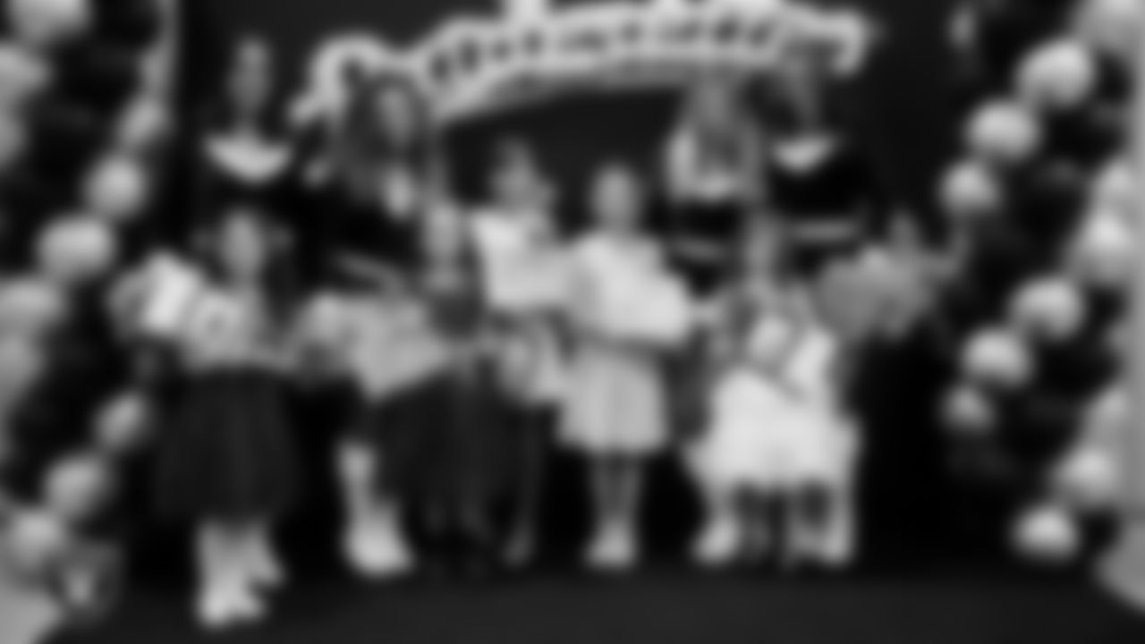 Raiderettes pose for a photo with Junior Raiderettes during the Junior Raiderettes Banquet at The Studio.