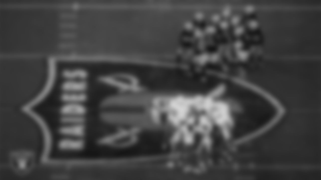 The Las Vegas Raiders defense huddles during the regular season home game against the Los Angeles Chargers at Allegiant Stadium.