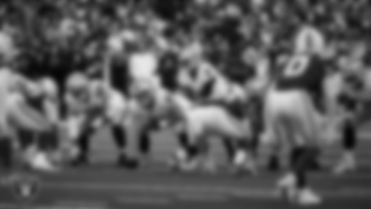 The Las Vegas Raiders offense lines up before the snap during the regular season away game against the Indianapolis Colts at Lucas Oil Stadium.