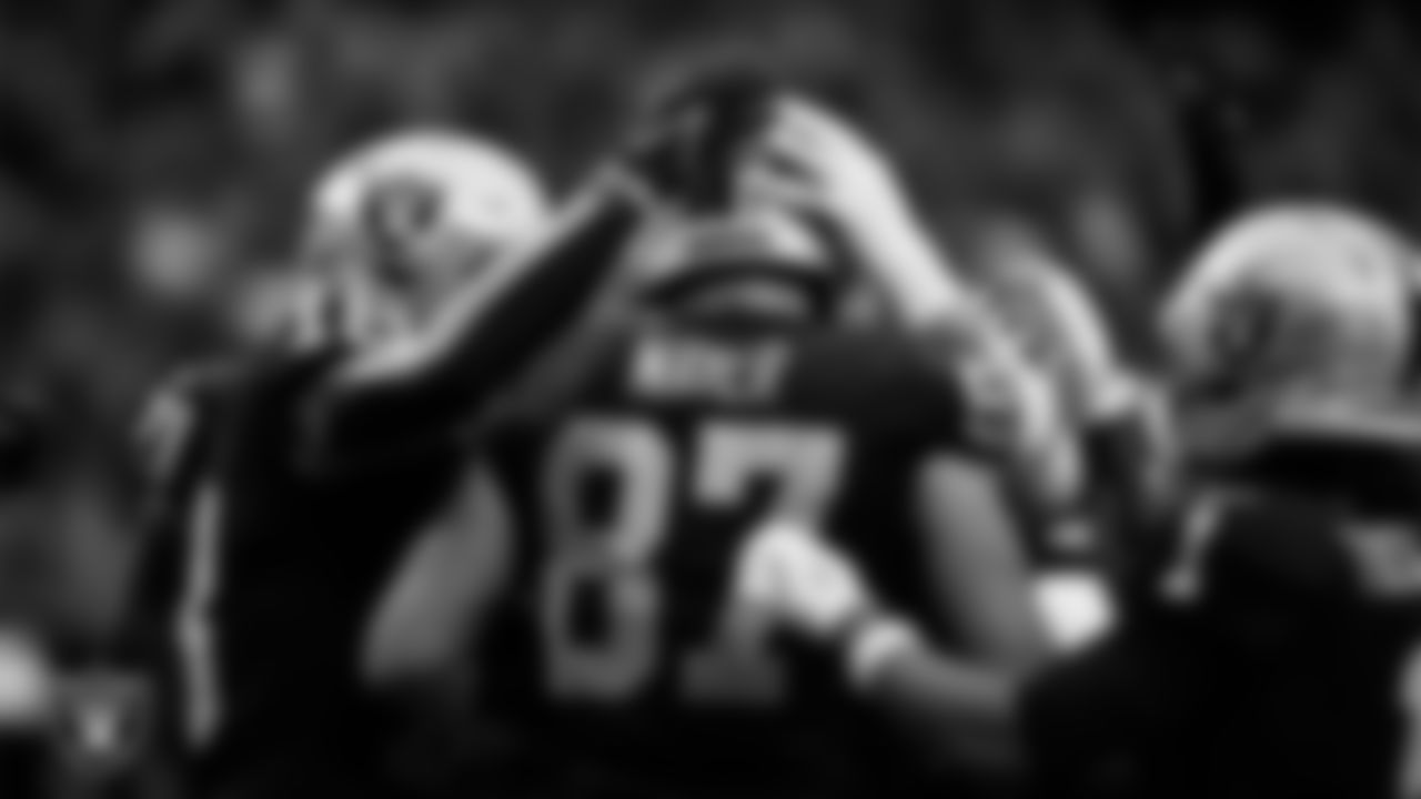 Las Vegas Raiders tight end Michael Mayer (87) celebrates with teammates after making a 4-yard touchdown catch during the regular season home game against the Tennessee Titans at Allegiant Stadium.