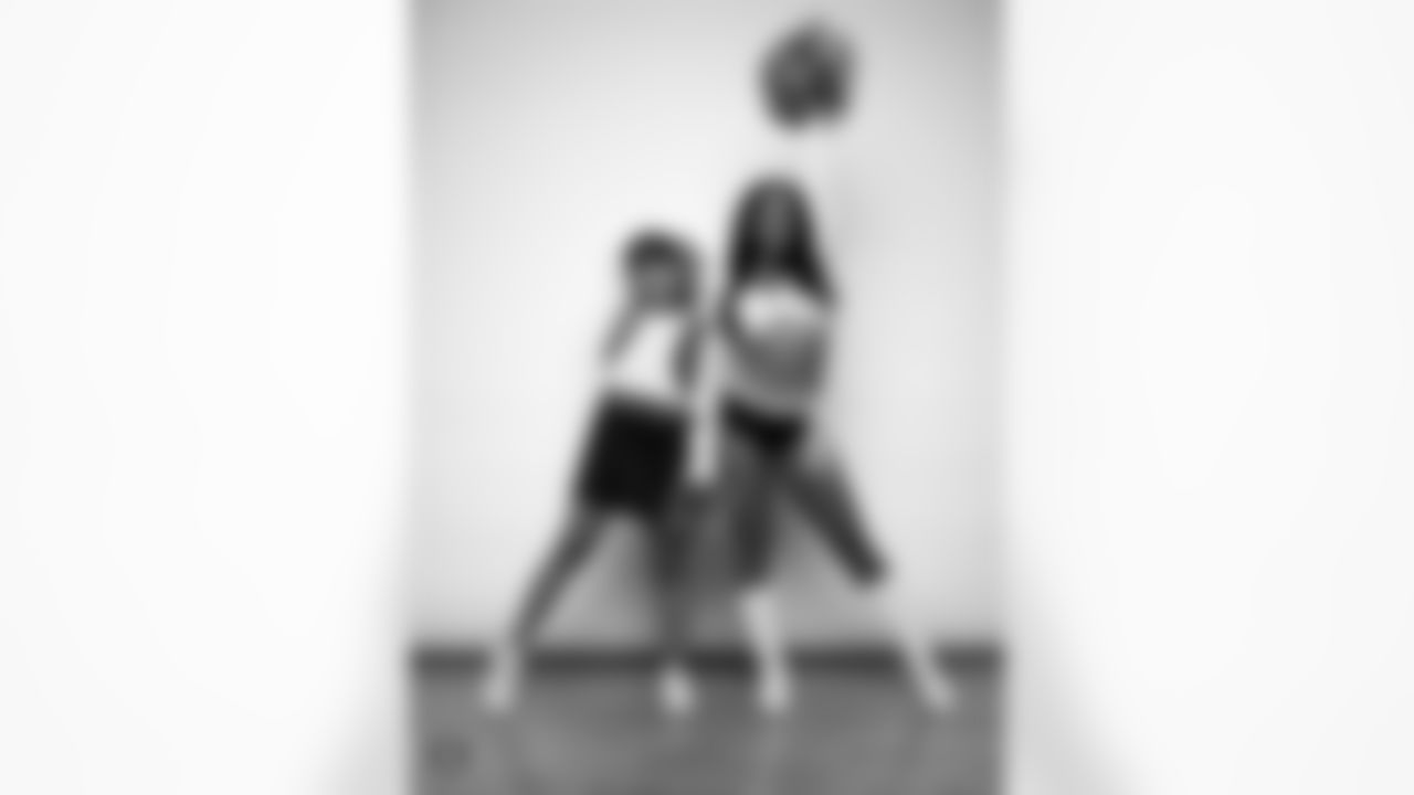 Raiderette Cierra poses for a photo with a Junior Raiderette during 2025 Media Day at The Studio.