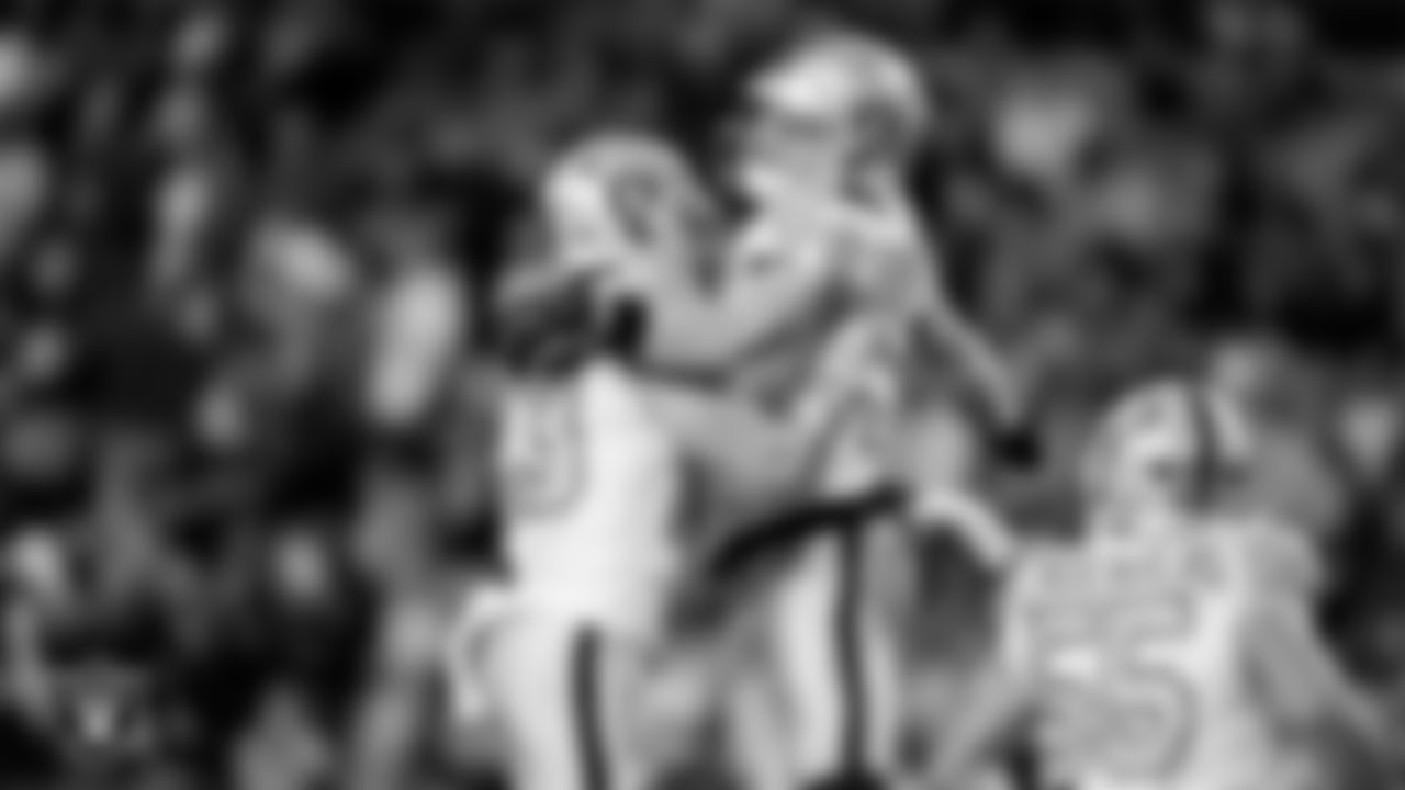 Las Vegas Raiders running back Dylan Laube (23) and linebacker Tommy Eichenberg (44) during the regular season away game against the Denver Broncos at Empower Field at Mile High.