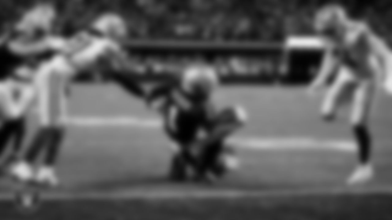 Las Vegas Raiders wide receiver Tre Tucker (1) dives into the end zone after making a 6-yard touchdown catch during the regular season home game against the Dallas Cowboys at Allegiant Stadium.