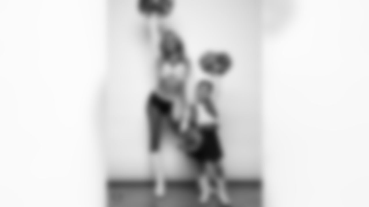 Raiderette Hayley poses for a photo with a Junior Raiderette during 2025 Media Day at The Studio.