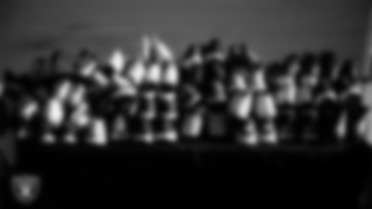 Cleats and shoes organized on a table during the Raiders' Equipment Blitz at Intermountain Health Performance Center.