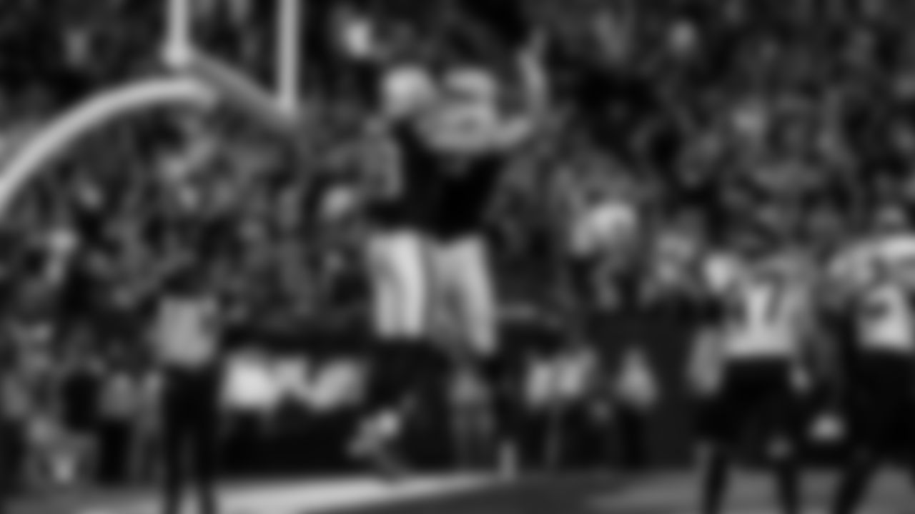 Las Vegas Raiders tight end Brock Bowers (89) celebrates with guard/center Jackson Powers-Johnson (58) after making a 2-yard touchdown catch during the regular season home game against the Jacksonville Jaguars at Allegiant Stadium.