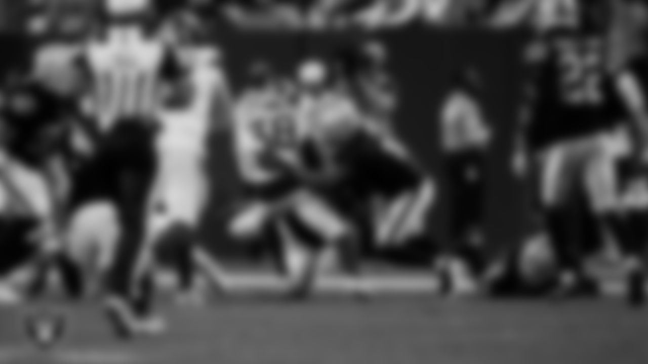 Las Vegas Raiders safety Jeremy Chinn (11) makes a tackle during the regular season home game against the Denver Broncos at Allegiant Stadium.