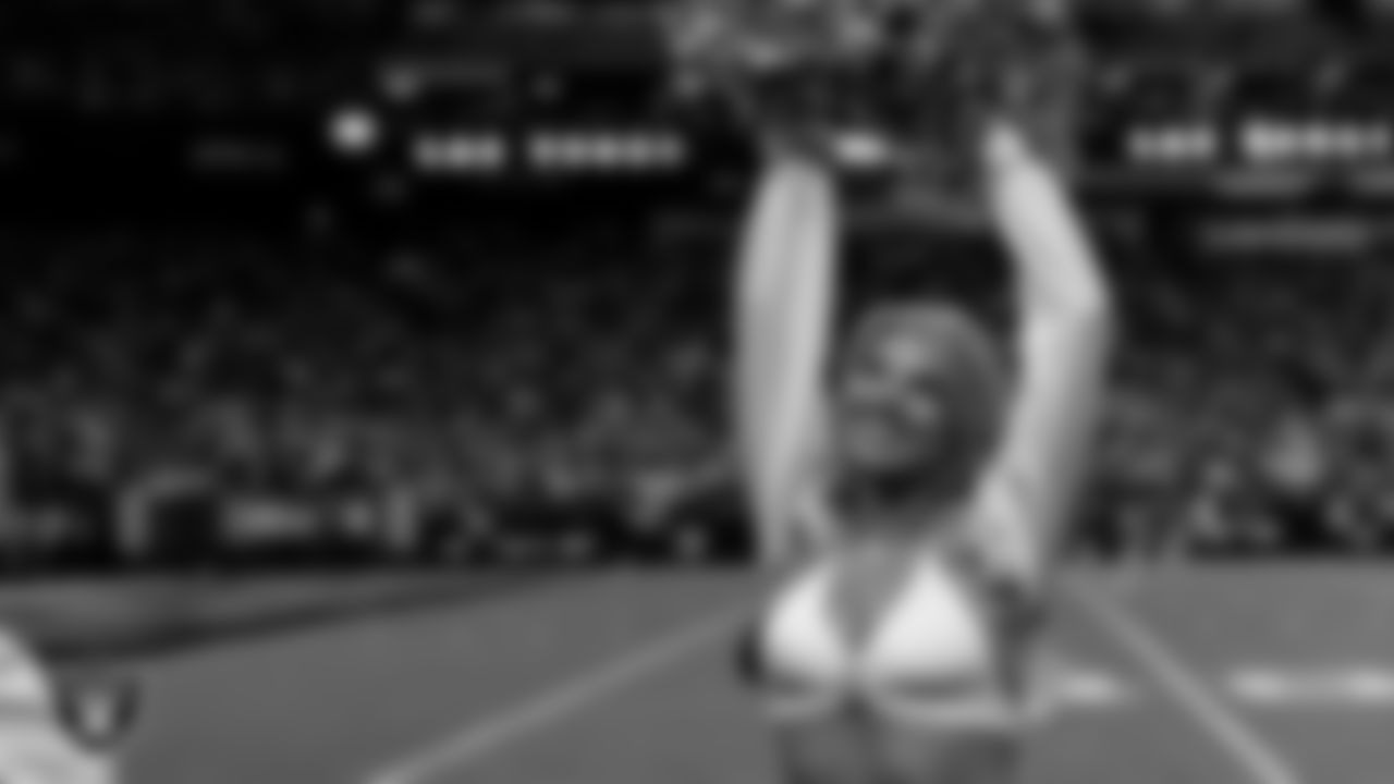 Raiderette Cori on the sidelines during the regular season home game against the Dallas Cowboys at Allegiant Stadium.