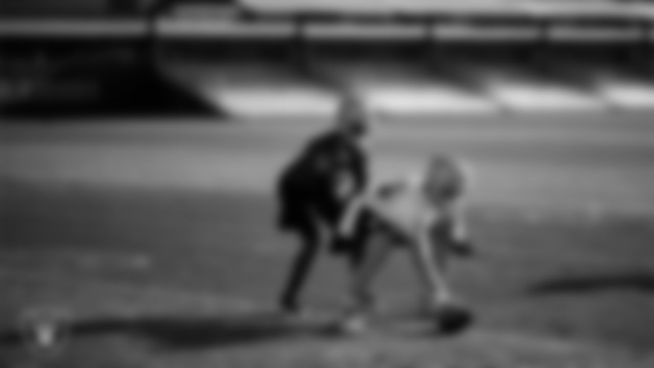 Las Vegas Raiders quarterback Geno Smith (7) and guard Alex Cappa (65) during practice at Intermountain Health Performance Center.