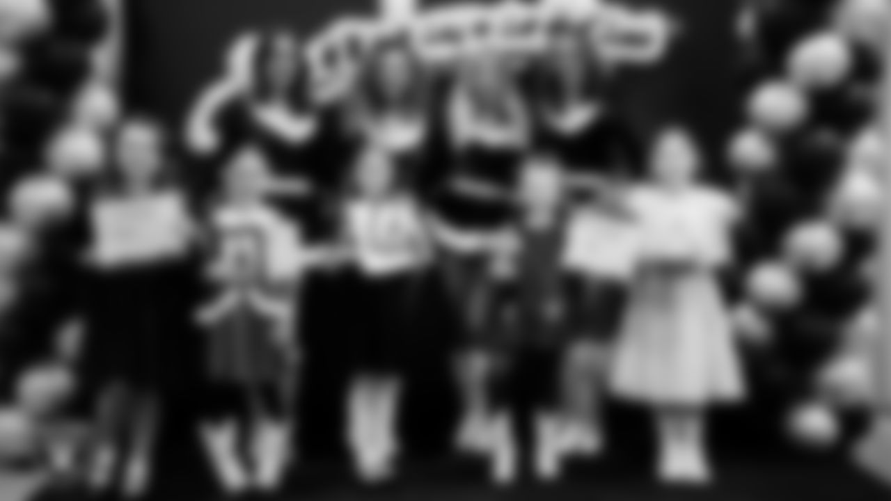 Raiderettes pose for a photo with Junior Raiderettes during the Junior Raiderettes Banquet at The Studio.