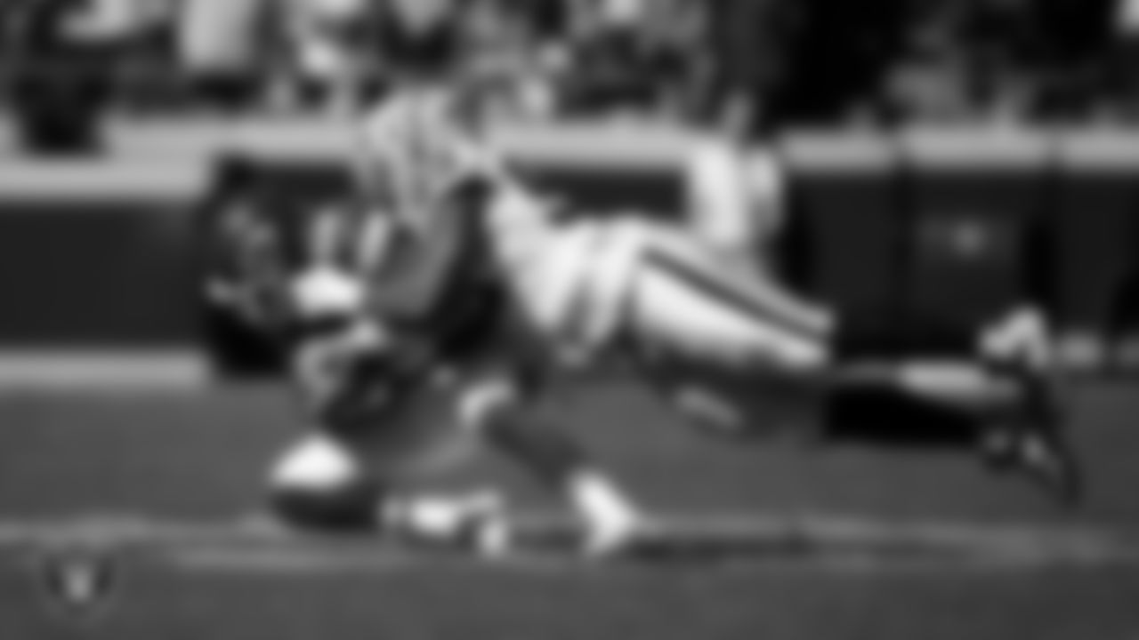 Las Vegas Raiders defensive tackle Thomas Booker IV (99) makes a tackle during the regular season away game against the Kansas City Chiefs at GEHA Field at Arrowhead Stadium.