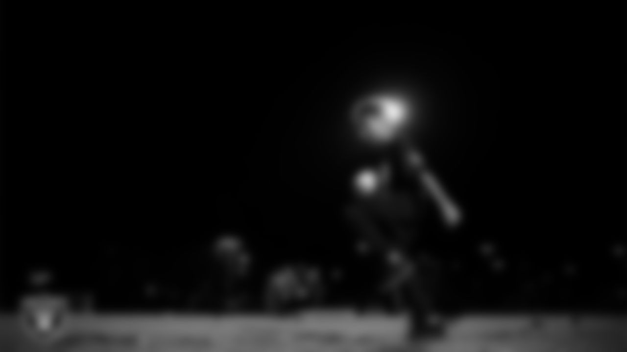 An athlete takes part in a Silver and Black League flag football clinic at Bill and Lillie Heinrich YMCA.