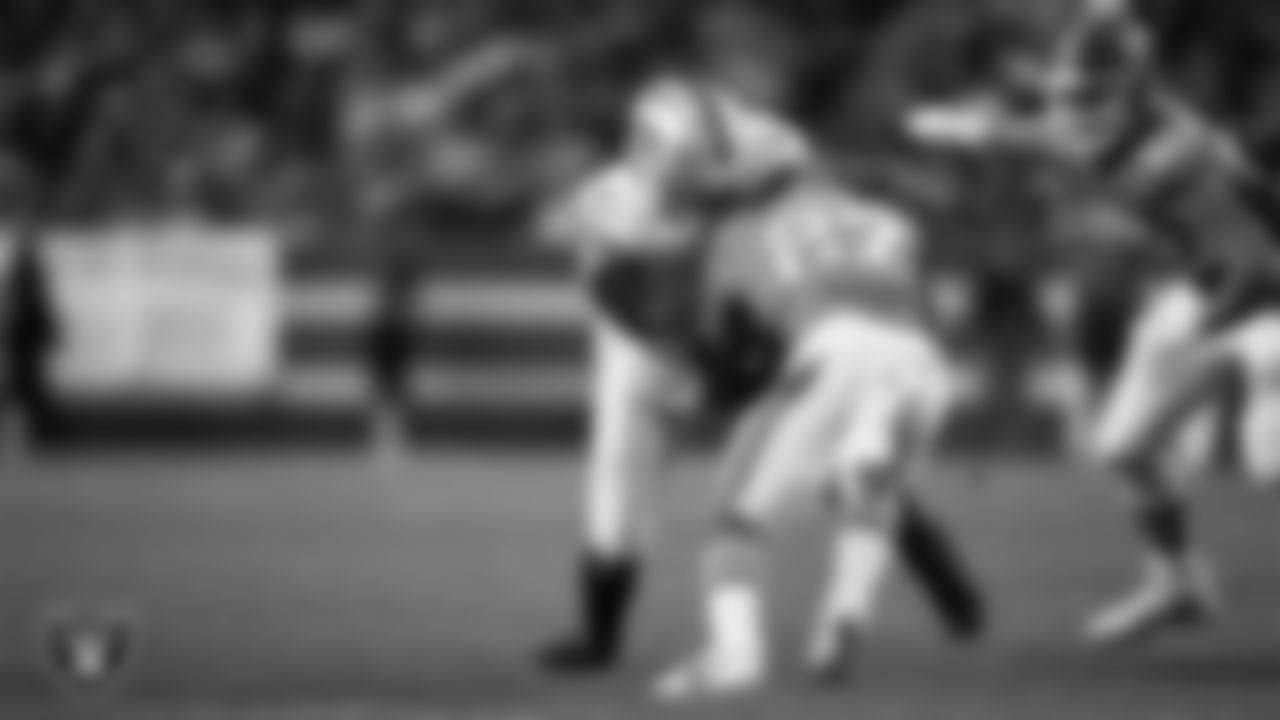 Las Vegas Raiders defensive end Tyree Wilson (9) makes a tackle during the regular season away game against the Denver Broncos at Empower Field at Mile High.