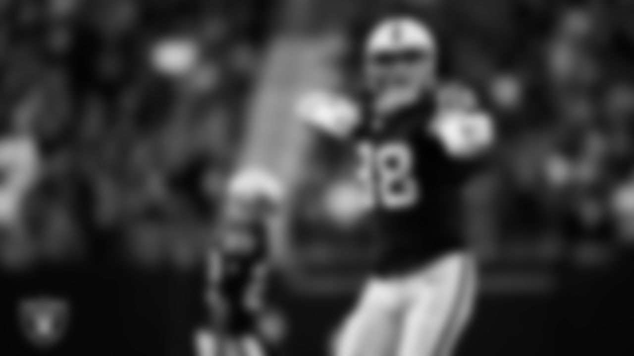 Las Vegas Raiders defensive end Maxx Crosby (98) celebrates after sacking the quarterback during the regular season home game against the Tennessee Titans at Allegiant Stadium.