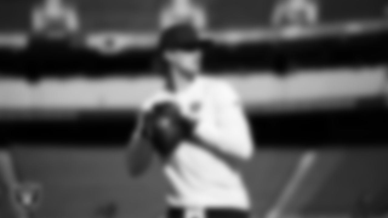 Las Vegas Raiders quarterback Kenny Pickett (15) warming up before the regular season away game against the Kansas City Chiefs at GEHA Field at Arrowhead Stadium.