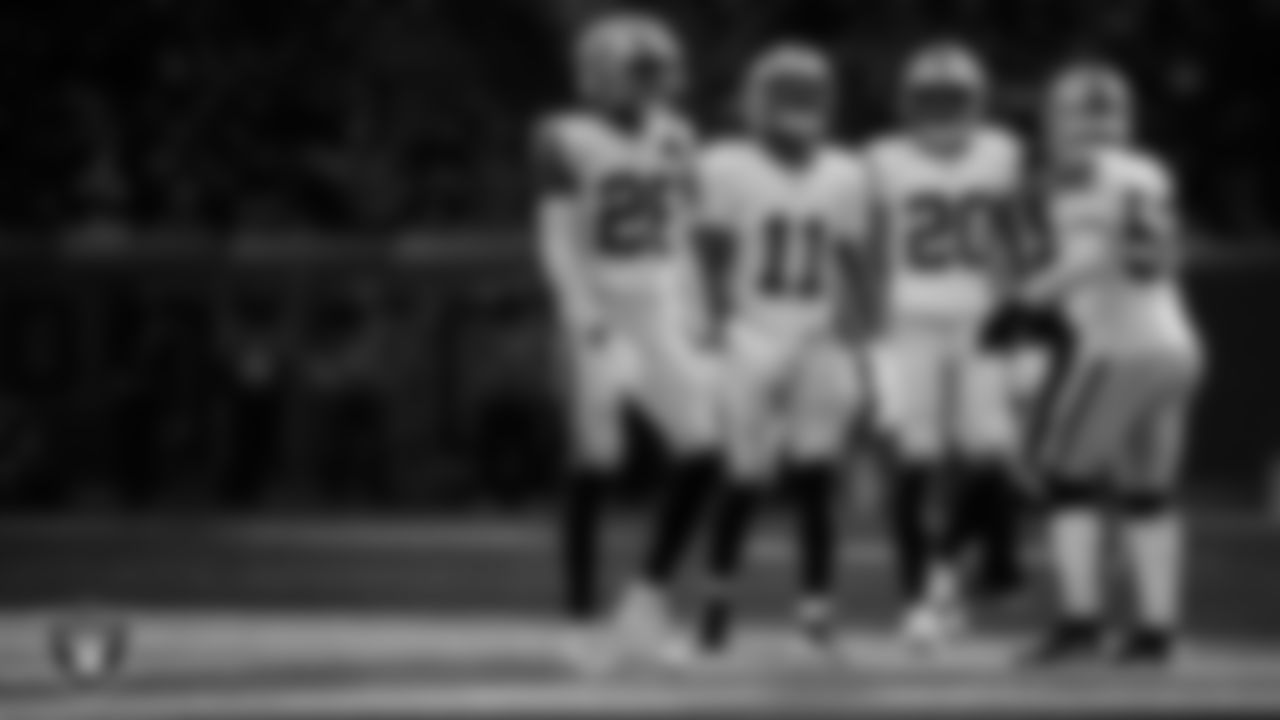 Las Vegas Raiders cornerback Darien Porter (26), safety Jeremy Chinn (11), safety Isaiah Pola-Mao (20) and linebacker Elandon Roberts (52) on the field during the regular season away game against the Houston Texans at NRG Stadium.