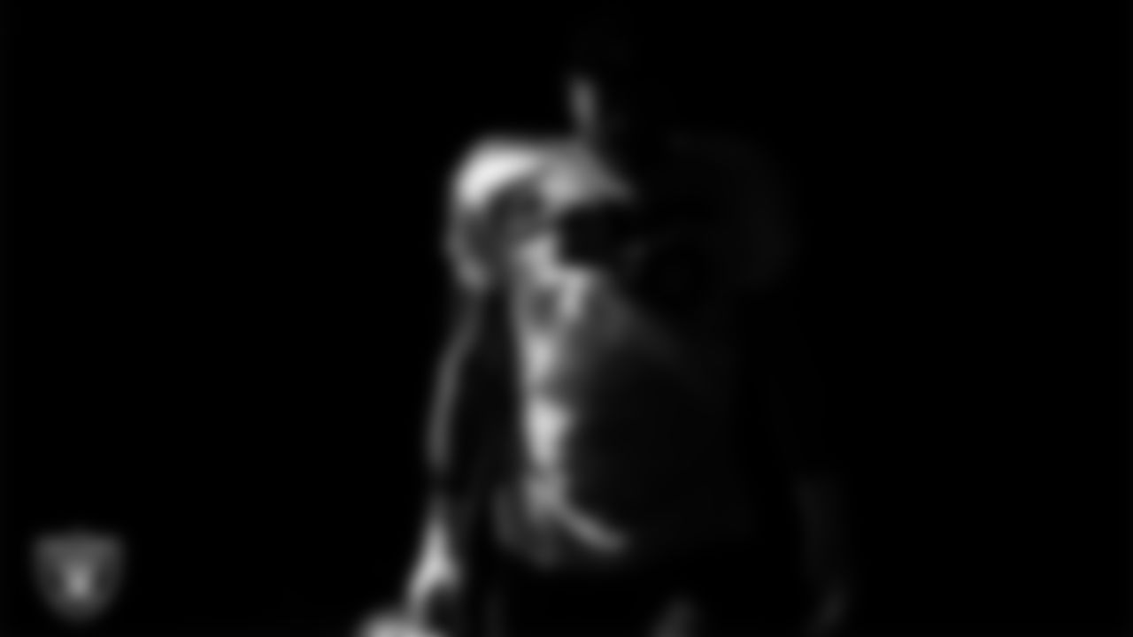 Las Vegas Raiders defensive tackle Jonah Laulu (96) walks out to the field for practice at Intermountain Health Performance Center.