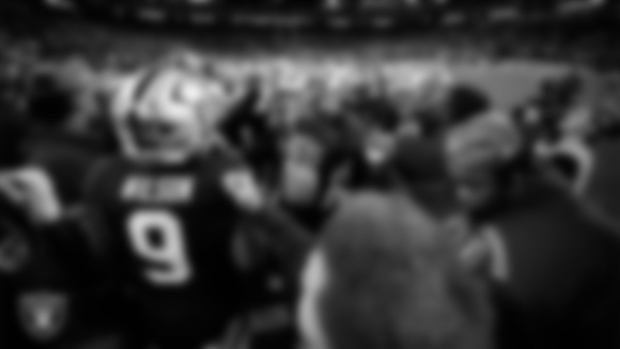 The Las Vegas Raiders huddle before the regular season home game against the Dallas Cowboys at Allegiant Stadium.