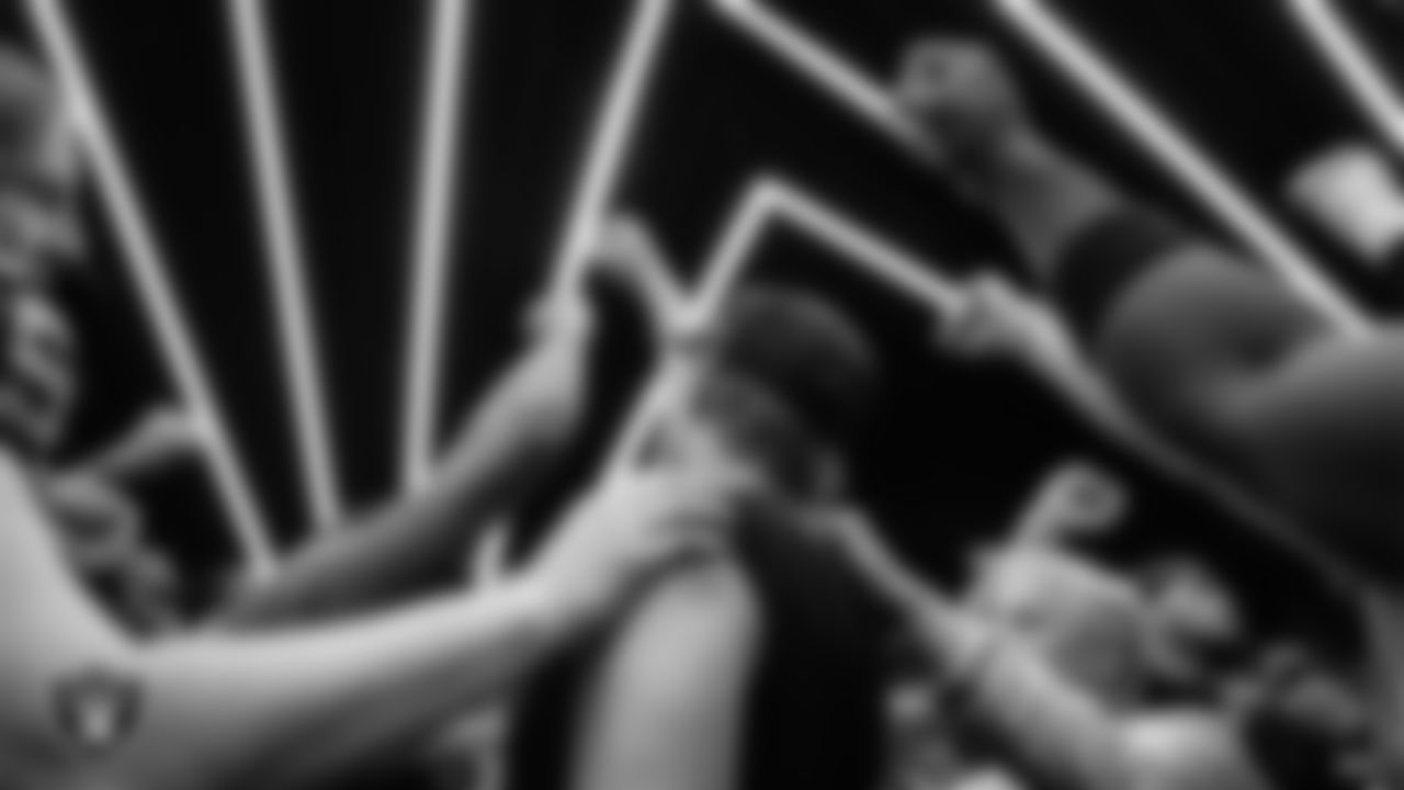 The Las Vegas Raiders huddle in the locker room after the regular season home game against the Kansas City Chiefs at Allegiant Stadium.