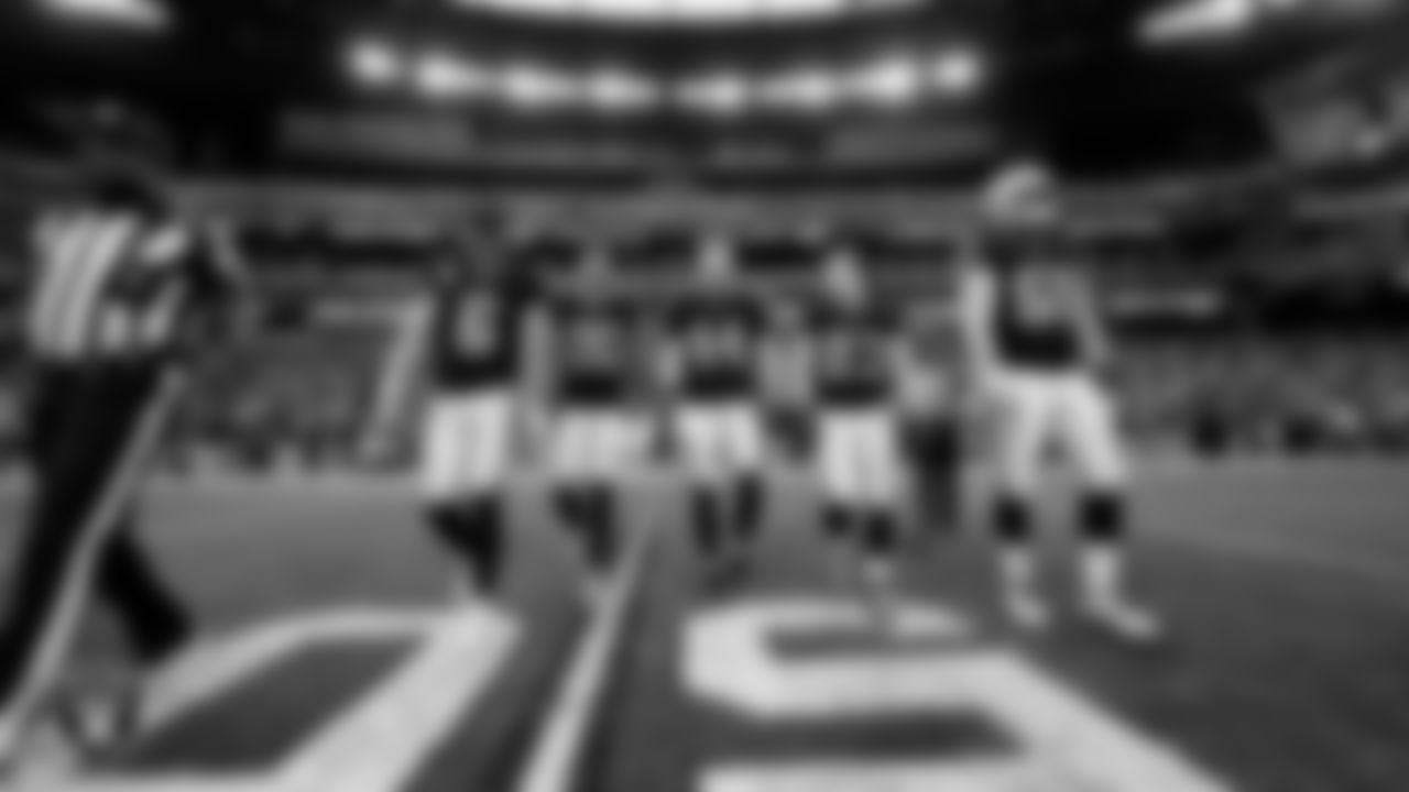 The Las Vegas Raiders walk out to the center of the field for the coin toss before the regular season home game against the the Kansas City Chiefs at Allegiant Stadium.