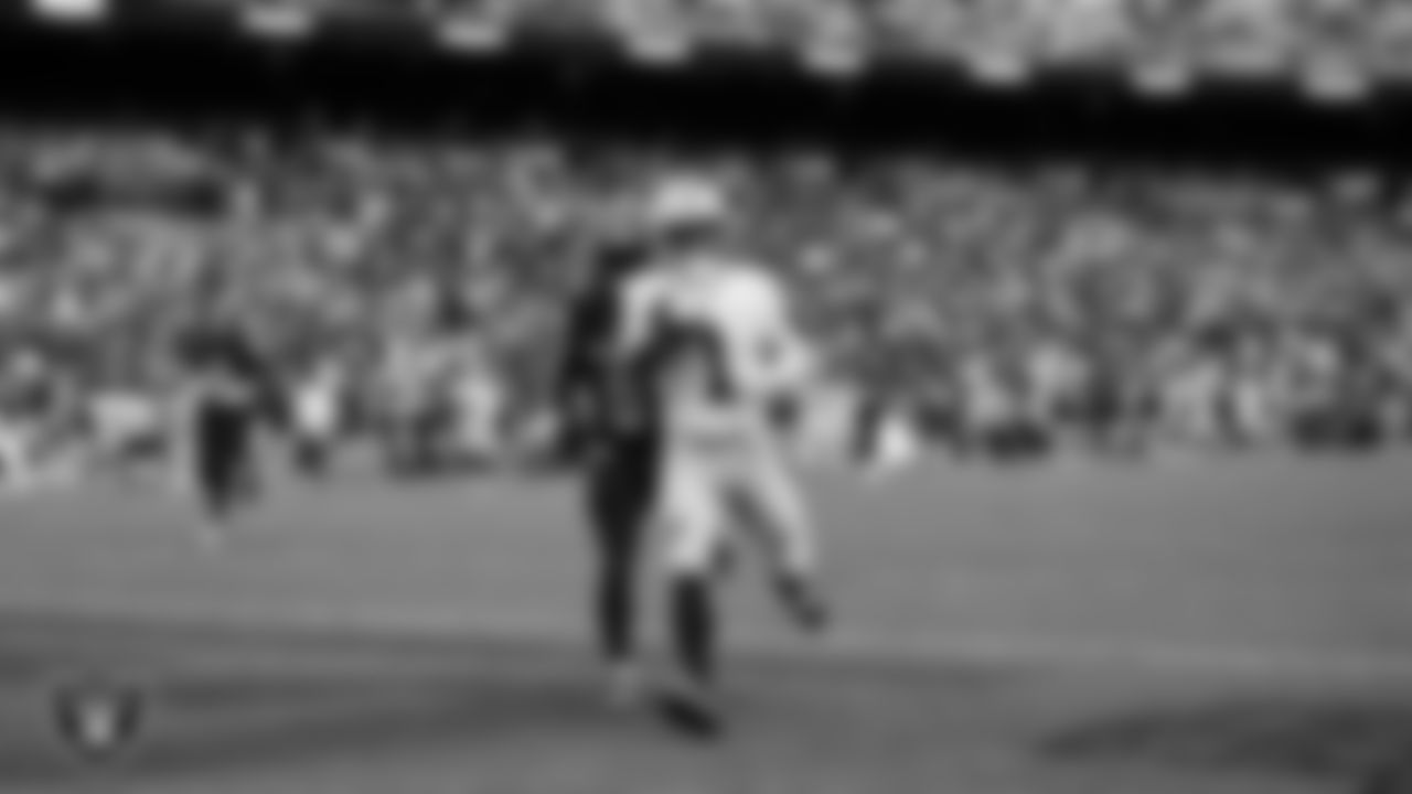 Las Vegas Raiders wide receiver Tre Tucker (1) runs after making a 61-yard touchdown catch during the regular season away game against the Washington Commanders at Northwest Stadium.