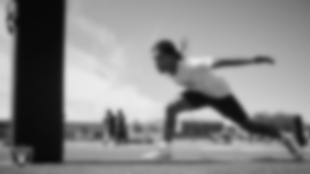 An athlete goes through a drill during a youth football combine at Durango High School.