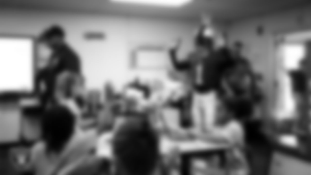 Raider Rusher visits a classroom during a 'Lil Raiders Pop-Up at Matt Kelly Elementary School.